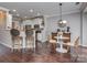 Cozy breakfast nook featuring hardwood floors and views into the kitchen and bar stool seating at 2331 Whitford Ln, Charlotte, NC 28210