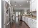 Bright, spacious kitchen with stainless steel appliances, granite countertops, and dark hardwood floors at 2331 Whitford Ln, Charlotte, NC 28210