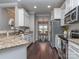 Stylish kitchen with white cabinets, stainless steel appliances, and an open view into the dining area at 2331 Whitford Ln, Charlotte, NC 28210