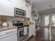 Well-equipped kitchen featuring stainless steel appliances, granite counters, and ample cabinet space at 2331 Whitford Ln, Charlotte, NC 28210