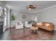 Bright living room featuring hardwood floors, modern furniture and tasteful decor at 2331 Whitford Ln, Charlotte, NC 28210