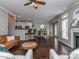 Spacious living room blending with the dining area, featuring hardwood floors and modern lighting at 2331 Whitford Ln, Charlotte, NC 28210
