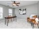 Home office with large ceiling fan, modern desk, and stylish chair at 2331 Whitford Ln, Charlotte, NC 28210