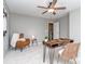 Office showcasing a modern wooden desk with chair and stylish accent chair at 2331 Whitford Ln, Charlotte, NC 28210