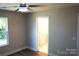 A bedroom with hardwood floors and a view to an adjacent bathroom with marble floors at 256 Lincoln Sw St # 1, Concord, NC 28025