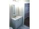 Bathroom vanity with modern mirror, cabinet, and walk in closet at 256 Lincoln Sw St # 1, Concord, NC 28025