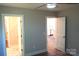 A neutral bedroom with hard wood floors, two doors, and ample space at 256 Lincoln Sw St # 1, Concord, NC 28025