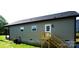 Back of the house features a small deck with steps and neutral colored siding at 256 Lincoln Sw St # 1, Concord, NC 28025