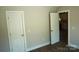 Hallway view with a door leading into the kitchen at 256 Lincoln Sw St # 1, Concord, NC 28025