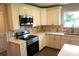 Modern kitchen with stainless steel appliances and white cabinetry at 256 Lincoln Sw St # 1, Concord, NC 28025
