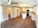Bright and open living space with new wood floors and kitchen featuring white cabinetry at 256 Lincoln Sw St # 1, Concord, NC 28025