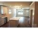 Open concept design with wood flooring, white cabinets, and plenty of natural light at 256 Lincoln Sw St # 1, Concord, NC 28025