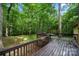 A wood back deck features a lovely view of the surrounding trees and yard at 3000 Low Gap Rd, Waxhaw, NC 28173