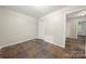 Bedroom with earth tone flooring, closet, and open doorway to hall at 3000 Low Gap Rd, Waxhaw, NC 28173