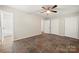 Bedroom featuring neutral paint, closet, earth tone flooring, and open doorway to bathroom at 3000 Low Gap Rd, Waxhaw, NC 28173