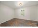 Cozy bedroom with shuttered window, light fixture, and tiled floor at 3000 Low Gap Rd, Waxhaw, NC 28173