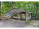 A detached garage with a carport offers ample parking and storage at 3000 Low Gap Rd, Waxhaw, NC 28173