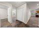 Hallway featuring tiled floor, closet with bi-fold doors, doorways, and white walls at 3000 Low Gap Rd, Waxhaw, NC 28173