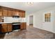 Kitchen features stainless steel appliances, wood cabinets, and tiled floor at 3000 Low Gap Rd, Waxhaw, NC 28173