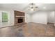 Living room with brick fireplace, mantle, and tiled floor at 3000 Low Gap Rd, Waxhaw, NC 28173