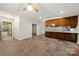 An open floor plan with tile flooring and a ceiling fan, with view into the screened porch at 3000 Low Gap Rd, Waxhaw, NC 28173