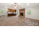 Spacious living room features a fireplace and tile flooring with a view of the kitchen at 3000 Low Gap Rd, Waxhaw, NC 28173