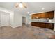 An open floor plan with tile flooring and a ceiling fan, with view into the screened porch at 3000 Low Gap Rd, Waxhaw, NC 28173