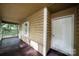 Screened porch featuring wood flooring, white trim, and painted exterior at 3000 Low Gap Rd, Waxhaw, NC 28173