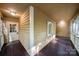 Screened porch featuring painted siding, wood flooring, white trim, and window at 3000 Low Gap Rd, Waxhaw, NC 28173