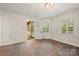 Room with open door to deck, shuttered window, tiled floors, and white walls at 3000 Low Gap Rd, Waxhaw, NC 28173