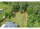 Aerial shot of the home surrounded by a lush green lawn and mature trees at 3178 Newcastle Dr # 42, Rock Hill, SC 29732