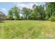 Expansive backyard with lush lawn and mature trees offers plenty of room to roam at 3178 Newcastle Dr # 42, Rock Hill, SC 29732