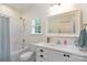 Clean bathroom with white vanity, tub, and shower combo and window at 3178 Newcastle Dr # 42, Rock Hill, SC 29732