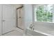 Clean bathroom featuring tiled walls, a bathtub, and a shower at 3178 Newcastle Dr # 42, Rock Hill, SC 29732