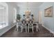 Elegant dining room with hardwood floors, chandelier lighting, and a large window for natural light at 3178 Newcastle Dr # 42, Rock Hill, SC 29732