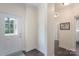 Welcoming entryway with sidelight window, hardwood floors, and view of hallway at 3178 Newcastle Dr # 42, Rock Hill, SC 29732