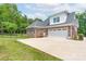 Brick home featuring an attached garage, well manicured lawn, and ample parking space at 3178 Newcastle Dr # 42, Rock Hill, SC 29732