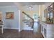 Inviting foyer with hardwood floors, a staircase, and views into the living room and dining area at 3178 Newcastle Dr # 42, Rock Hill, SC 29732