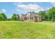 Spacious front yard leading to a well-maintained brick home with a welcoming front porch at 3178 Newcastle Dr # 42, Rock Hill, SC 29732