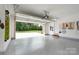 Open garage with epoxy flooring and view to a green backyard at 3178 Newcastle Dr # 42, Rock Hill, SC 29732