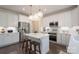 Well-lit kitchen with white cabinetry, stainless steel appliances, and a center island with seating at 3178 Newcastle Dr # 42, Rock Hill, SC 29732