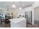 Spacious kitchen featuring an island, stainless steel appliances, and an adjacent dining area at 3178 Newcastle Dr # 42, Rock Hill, SC 29732