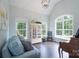 Comfortable living room with light-blue sofa, display cabinet, and large windows offering natural light at 3178 Newcastle Dr # 42, Rock Hill, SC 29732