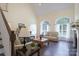 Bright living room with cathedral ceiling, hardwood floors, fireplace, and arch top windows at 3178 Newcastle Dr # 42, Rock Hill, SC 29732