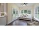 Cozy sunroom with hardwood floors, neutral sofa with throw pillows, and ample natural light at 3178 Newcastle Dr # 42, Rock Hill, SC 29732