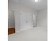 Neutral bedroom with carpet floors, a double door closet, and two entry doors at 3206 Lakehurst Xing, Matthews, NC 28104
