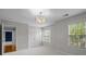 Carpeted bedroom with natural light and a closet for storage. Door to hall plus window view at 3206 Lakehurst Xing, Matthews, NC 28104