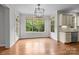 Bright breakfast nook with large windows providing views of the backyard and access to the outdoor area at 3206 Lakehurst Xing, Matthews, NC 28104