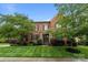 Beautiful brick home with manicured lawn and stone accents around the entrance at 3206 Lakehurst Xing, Matthews, NC 28104