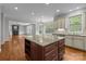 Gourmet kitchen showcasing a granite island, stainless appliances, and an open floor plan to the living area at 3206 Lakehurst Xing, Matthews, NC 28104